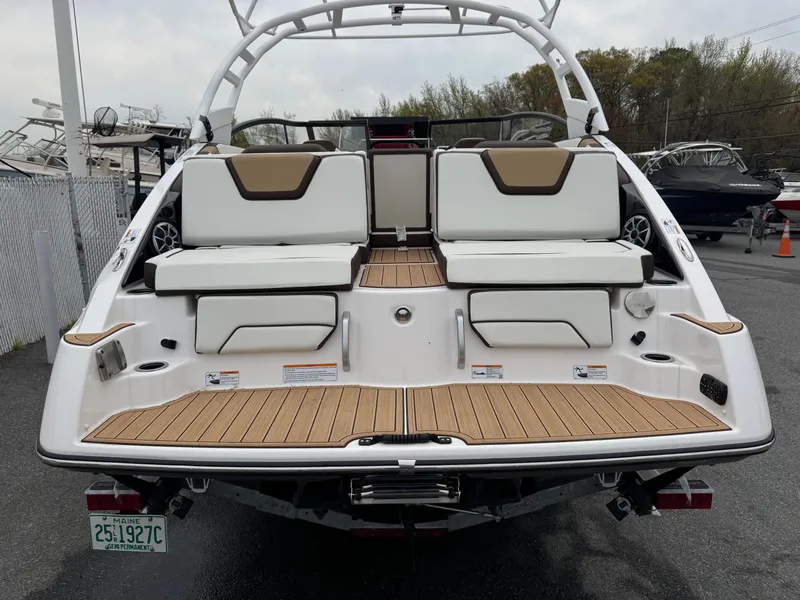 Slide: The Image of 2023 Yamaha Boats 252SE, rear view, showcasing spacious seating and sleek design. - 8