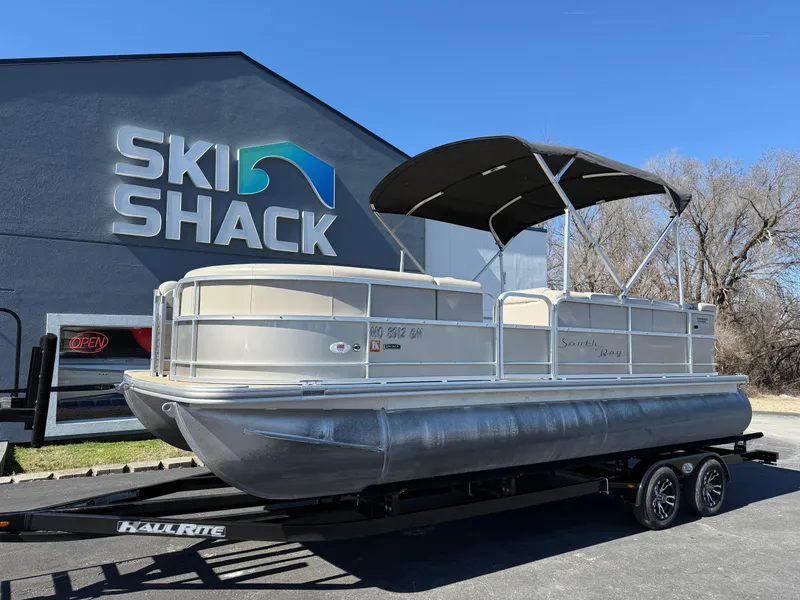 Slide: The Image of 2019 South Bay 222CR pontoon boat on trailer at Ski Shack dealership. - 1
