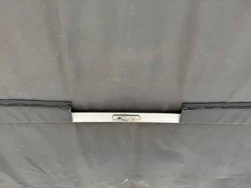Slide: The Image of 2019 South Bay 222CR boat cover with metal support bar. - 23
