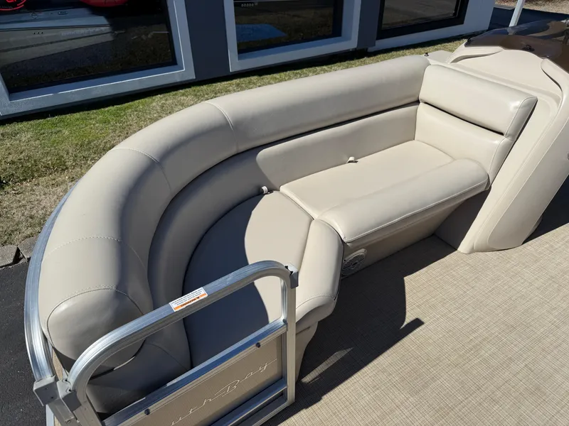 Slide: The Image of 2019 South Bay 222CR pontoon boat with beige seating and metal railing. - 6