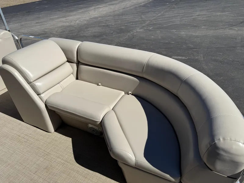 Slide: The Image of Luxurious seating on 2019 South Bay 222CR pontoon boat, featuring beige upholstery. - 7