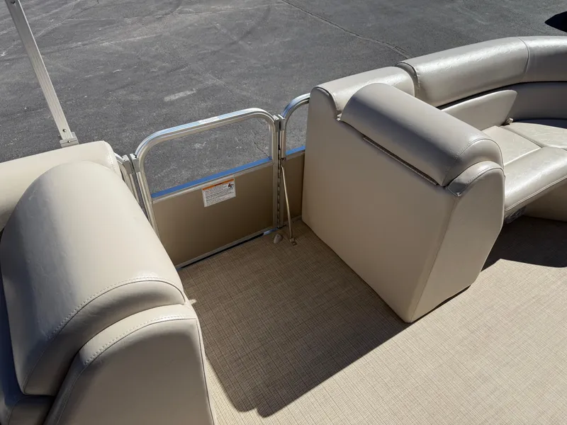 Slide: The Image of 2019 South Bay 222CR pontoon boat interior with beige seating and carpet. - 8