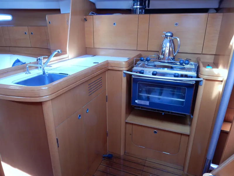 Slide: The Image of Interior of 2005 Beneteau First 44.7 yacht kitchen with sink and stove. - 11