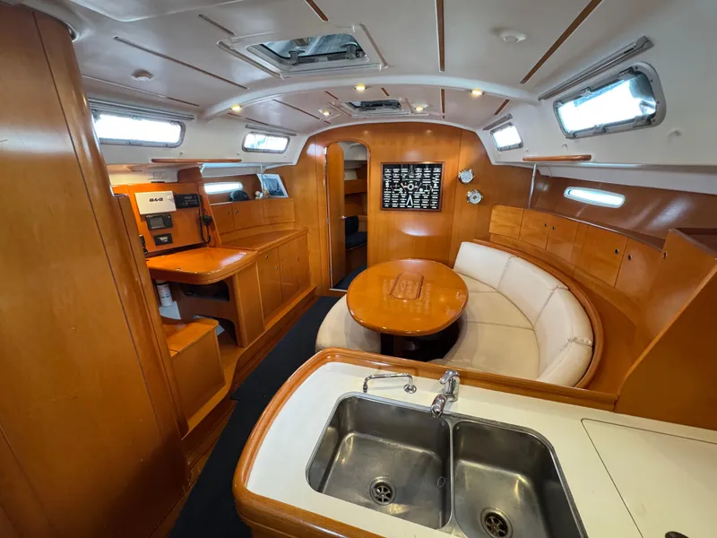 Slide: The Image of Luxurious interior of 2005 Beneteau First 44.7 yacht with wood finish and modern amenities. - 19