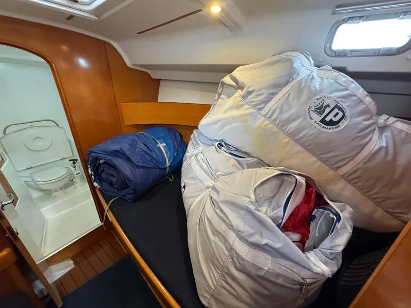 Slide: The Image of Cabin interior of 2005 Beneteau First 44.7 sailboat with sails and adjacent bathroom. - 30