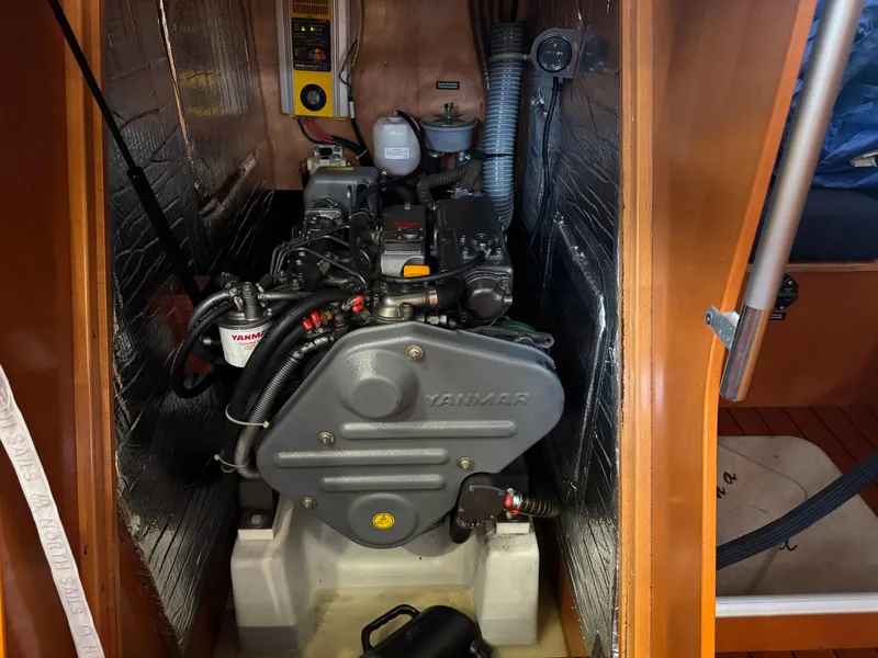 Slide: The Image of Engine compartment of a 2005 Beneteau First 44.7 sailboat, featuring a Yanmar engine. - 34