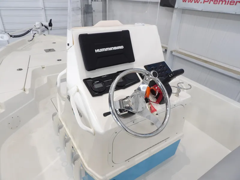 Slide: The Image of 2019 Skeeter SX210 boat console with steering wheel and Humminbird electronics. - 15