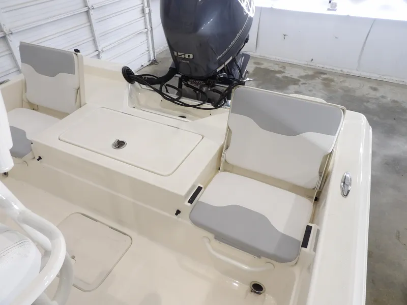 Slide: The Image of 2019 Skeeter SX210 boat interior with seating and Yamaha 150 engine. - 19