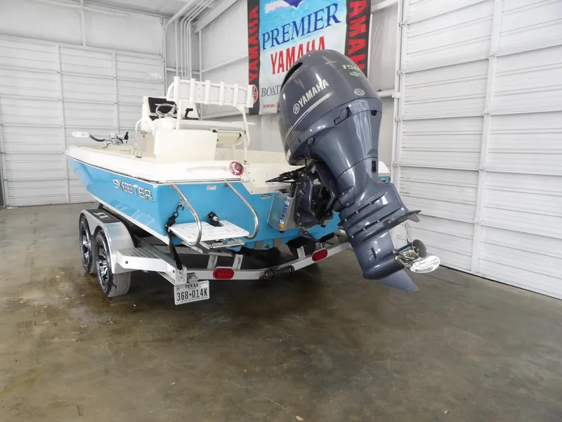 Slide: The Image of 2019 Skeeter SX210 boat with Yamaha motor in a showroom. - 6
