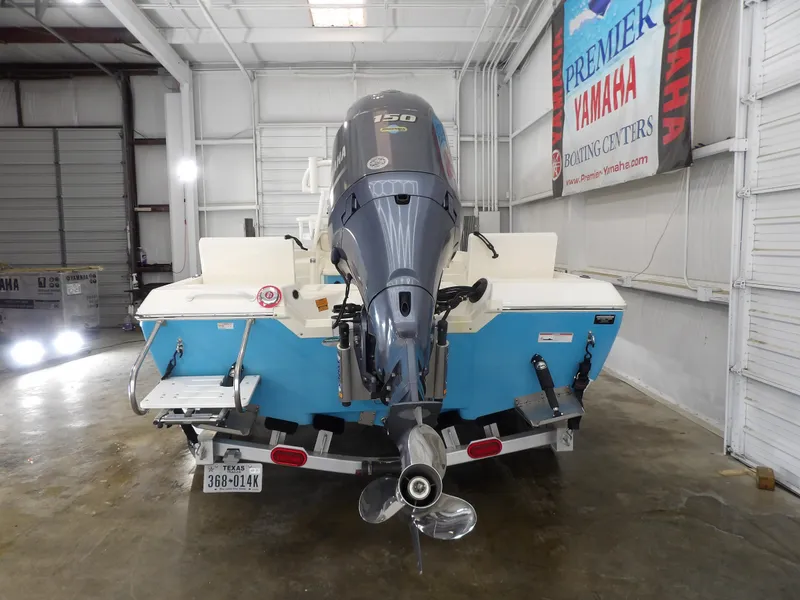 Slide: The Image of 2019 Skeeter SX210 boat with Yamaha engine in a showroom. - 8