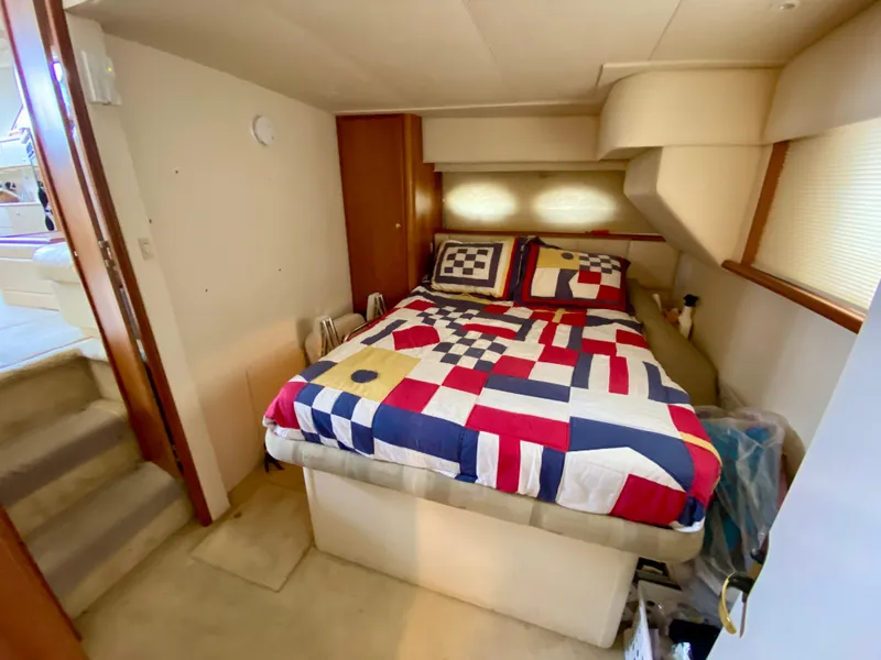 Slide: The Image of Cozy bedroom in 1999 Silverton 392 Motor Yacht with nautical-themed bedding. - 36