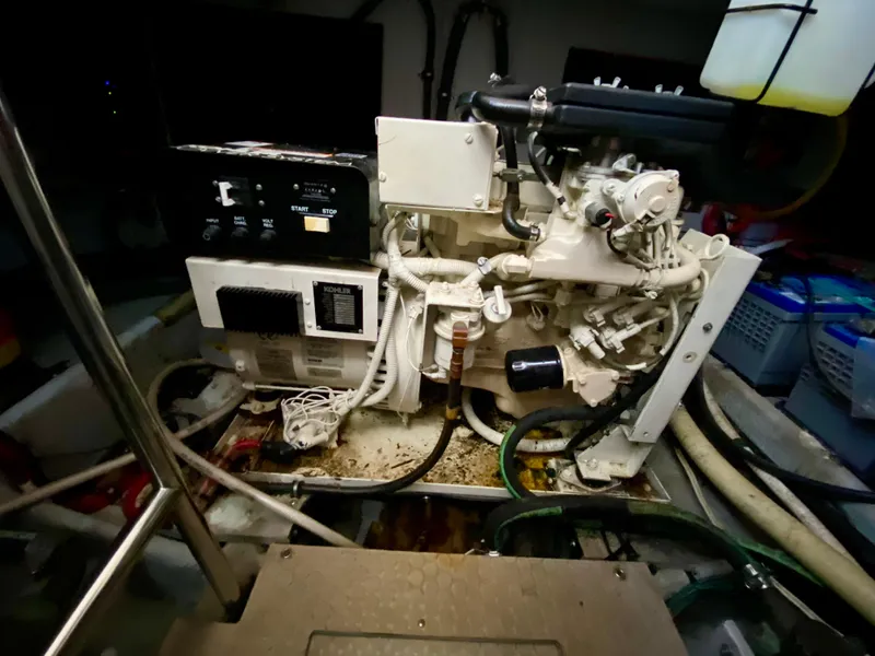 Slide: The Image of Engine room of a 1999 Silverton 392 Motor Yacht, showcasing mechanical components. - 37