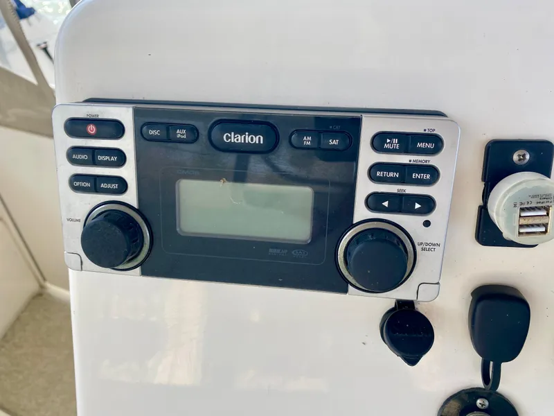 Slide: The Image of Clarion audio system on 1999 Silverton 392 Motor Yacht dashboard. - 40