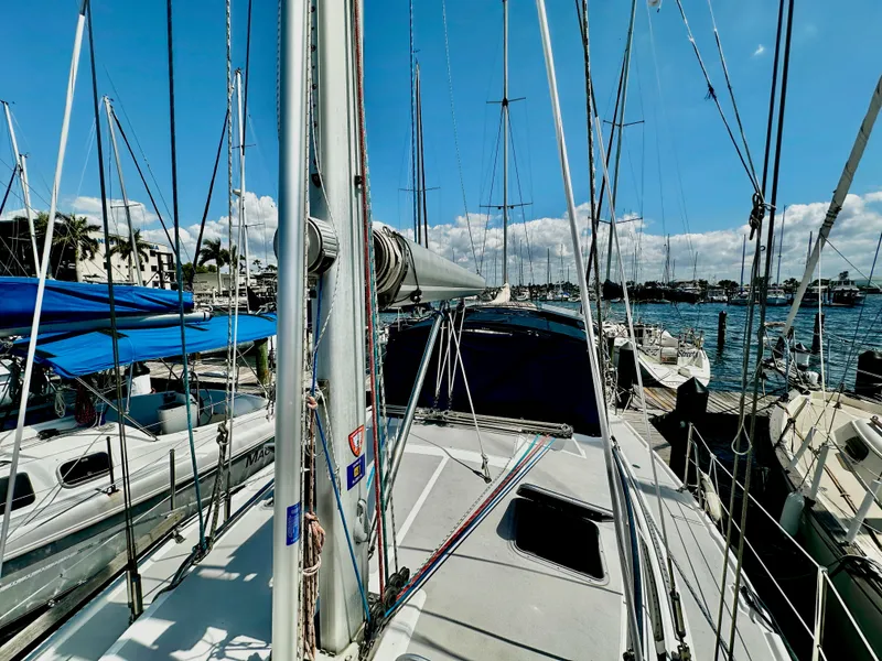 Slide: The Image of 2005 Catalina 350 sailboat docked in sunny marina. - 10
