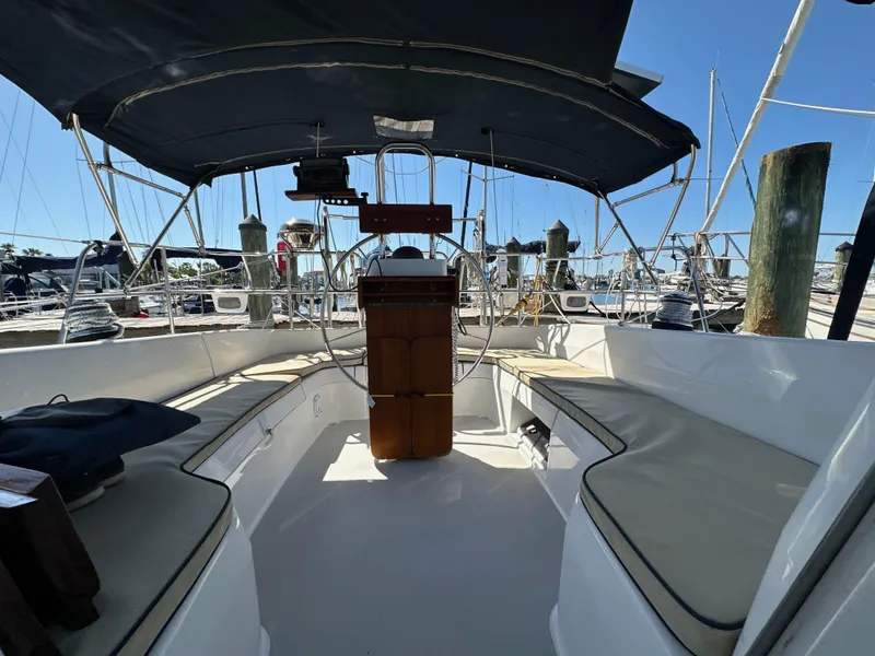 Slide: The Image of Interior view of a 2005 Catalina 350 yacht with seating area and helm. - 33