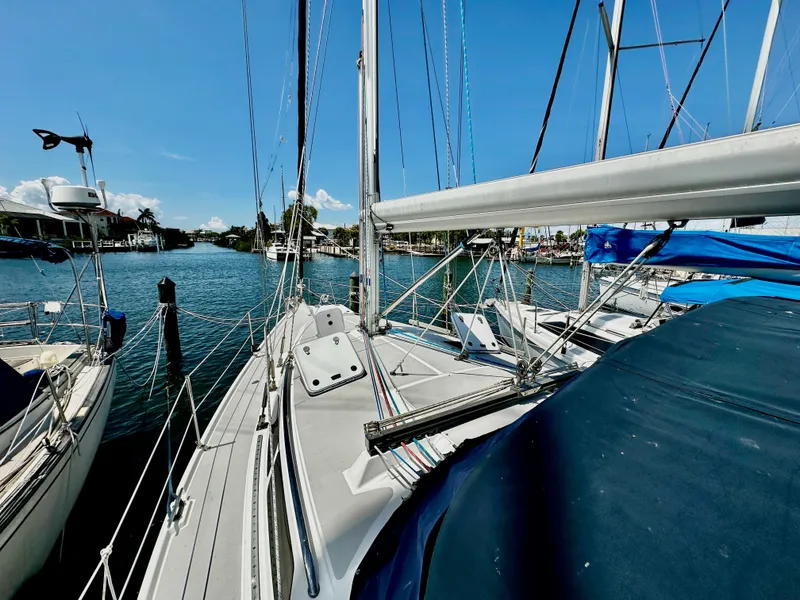 Slide: The Image of 2005 Catalina 350 sailboat docked in marina on a sunny day. - 38