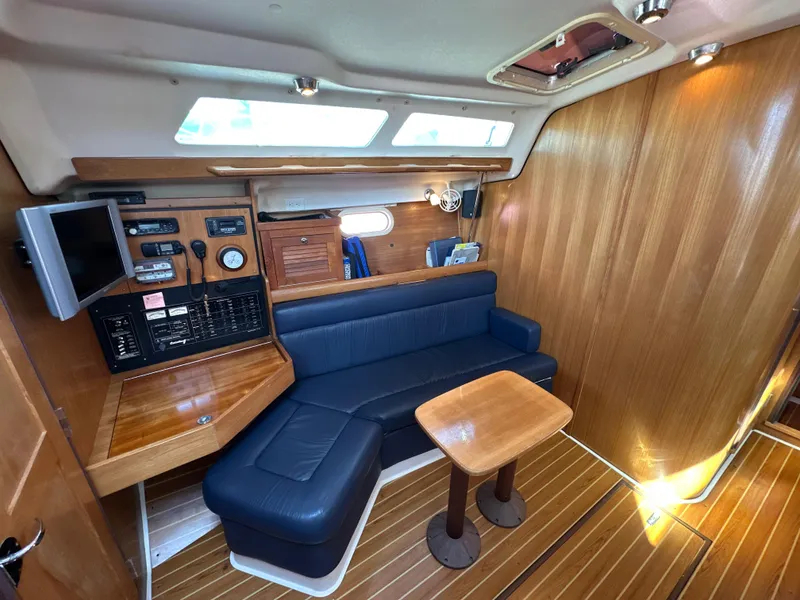 Slide: The Image of Interior of a 2005 Catalina 350 yacht with wooden finish. - 46