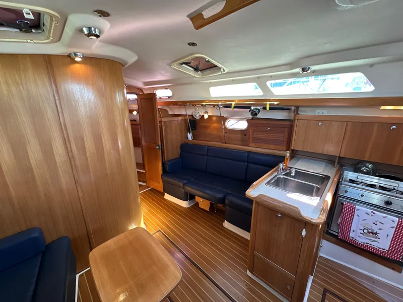 Slide: The Image of Interior of a 2005 Catalina 350 yacht with wood finish. - 48