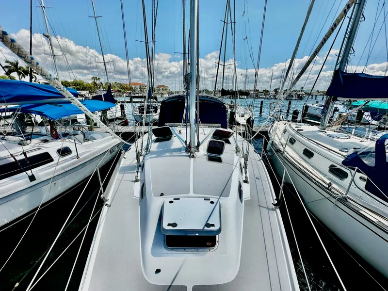 Slide: The Image of 2005 Catalina 350 sailboat docked in marina, sunny day. - 5