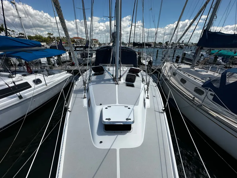 Slide: The Image of 2005 Catalina 350 sailboat docked in marina, sunny day. - 6