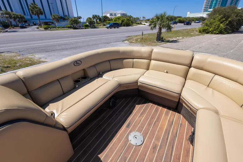 Slide: The Image of 2015 South Bay 724 SPORT DLX pontoon boat with tan seating and wood flooring. - 14