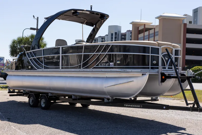 Slide: The Image of 2015 South Bay 724 SPORT DLX pontoon boat on trailer, parked outdoors. - 24