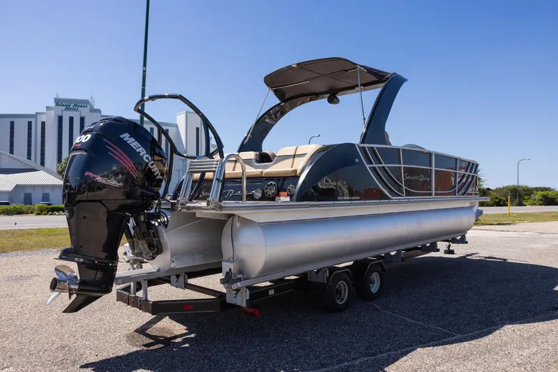 Slide: The Image of 2015 South Bay 724 SPORT DLX pontoon boat on trailer, featuring a Mercury outboard motor. - 5