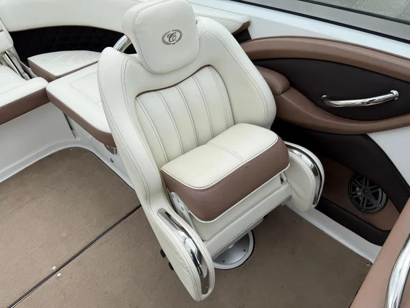 Slide: The Image of Luxurious seating in a 2013 Cobalt 242 boat with beige and brown upholstery. - 14