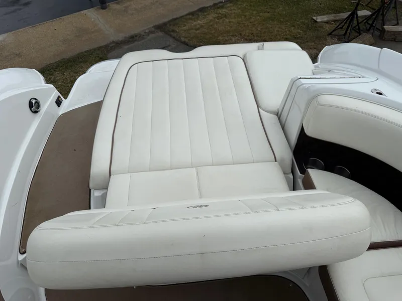 Slide: The Image of 2013 Cobalt 242 boat with white leather seating and sleek design. - 18