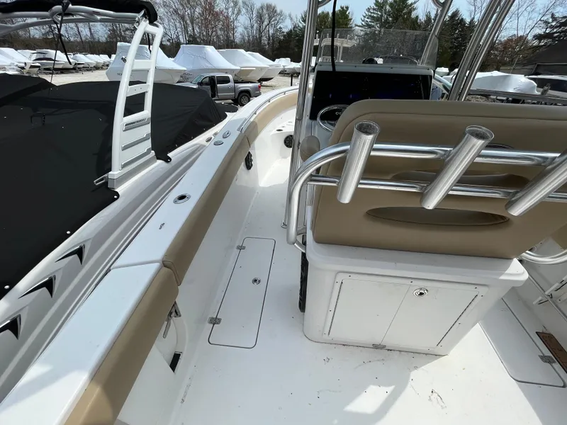 Slide: The Image of 2017 Sportsman 252 boat interior with seating and rod holders. - 10