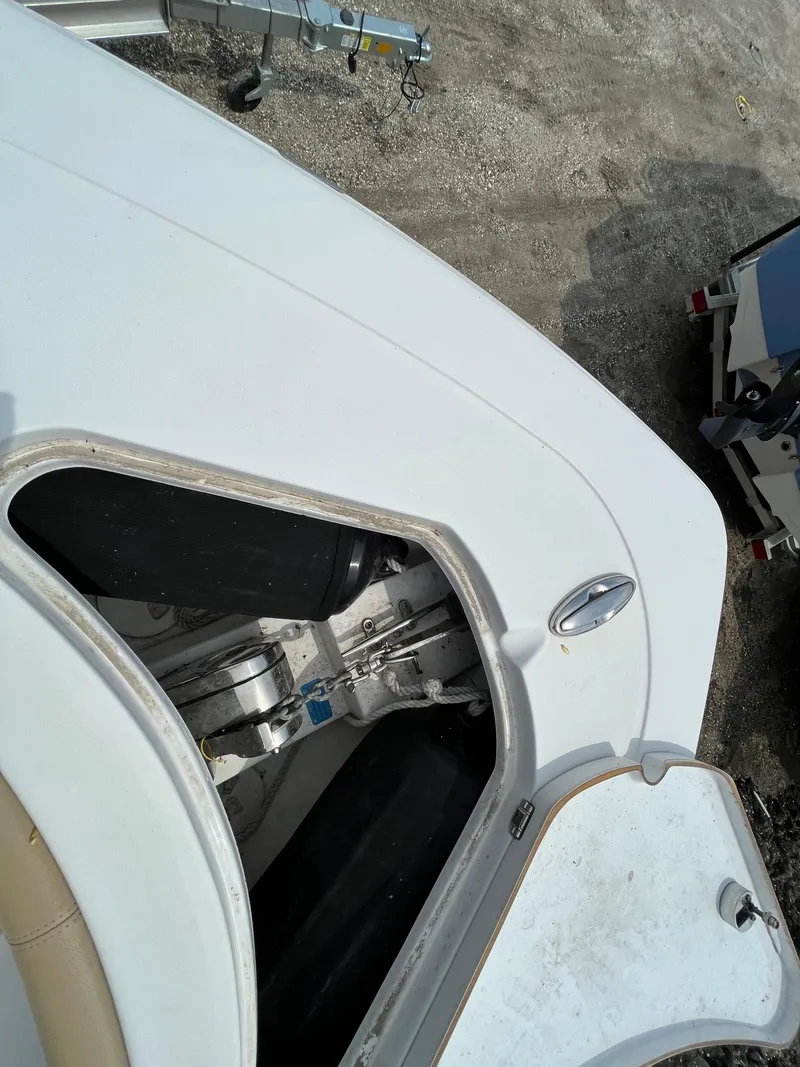 Slide: The Image of 2017 Sportsman 252 boat hatch open, revealing interior storage compartment. - 12