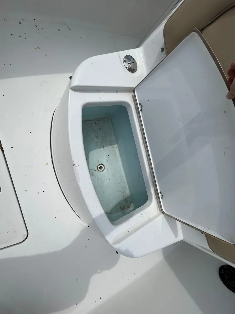 Slide: The Image of Open storage compartment on a 2017 Sportsman 252 boat. - 13