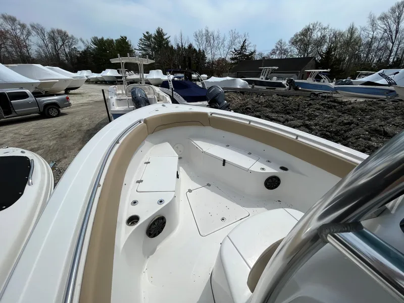 Slide: The Image of 2017 Sportsman 252 boat in storage yard, surrounded by other boats and vehicles. - 15
