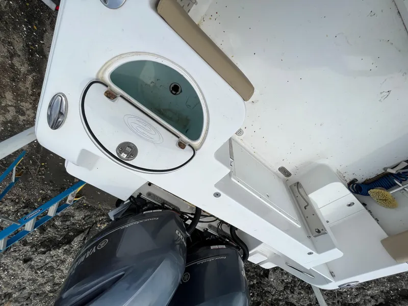 Slide: The Image of 2017 Sportsman 252 boat deck with dual engines and seating area. - 26