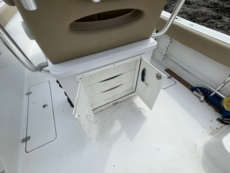 Slide: The Image of 2017 Sportsman 252 boat interior with open storage compartment and seating. - 27