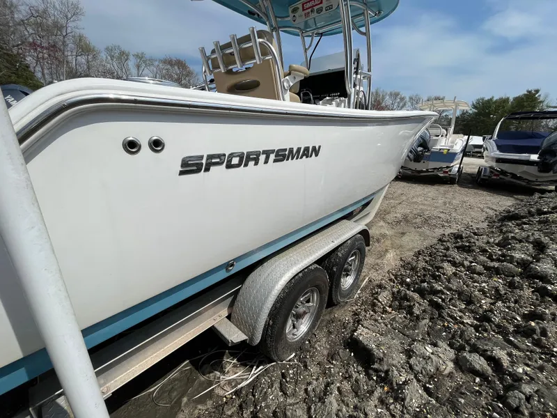 Slide: The Image of 2017 Sportsman 252 boat on trailer, parked outdoors, side view. - 3