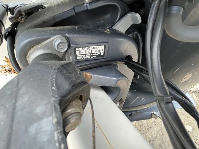 Slide: The Image of Close-up of Yamaha F200XCA engine on 2017 Sportsman 252 boat. - 36