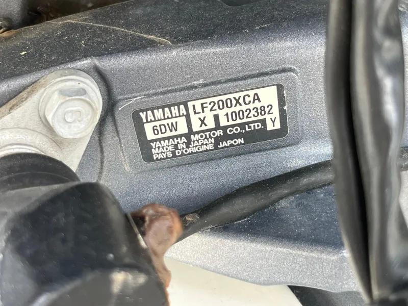 Slide: The Image of Yamaha LF200XCA engine label on a 2017 Sportsman 252 boat. - 37