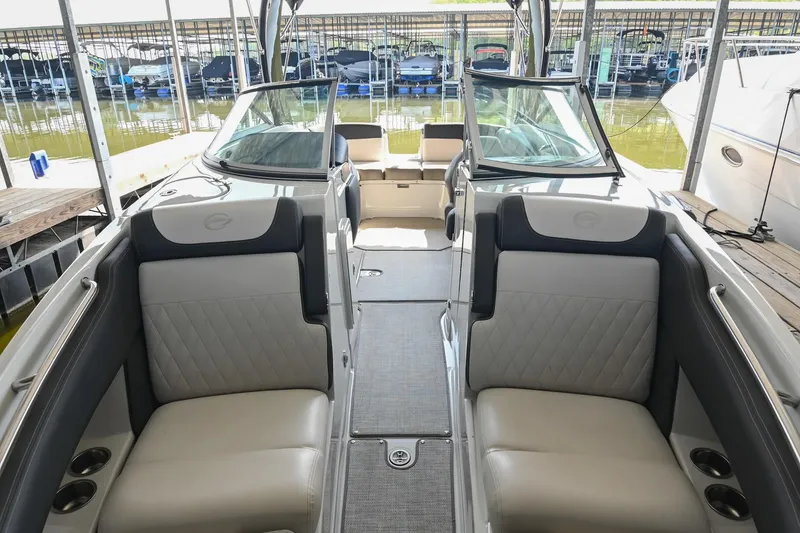 Slide: The Image of 2021 Crownline 265 SS boat interior with luxurious seating and modern design. - 11