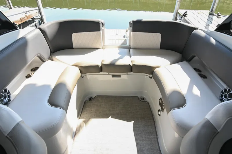 Slide: The Image of 2021 Crownline 265 SS boat interior with spacious seating and elegant design. - 12