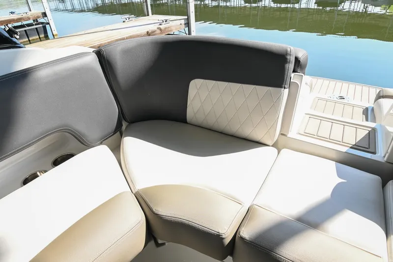 Slide: The Image of 2021 Crownline 265 SS boat interior seating with elegant upholstery and lake view. - 14
