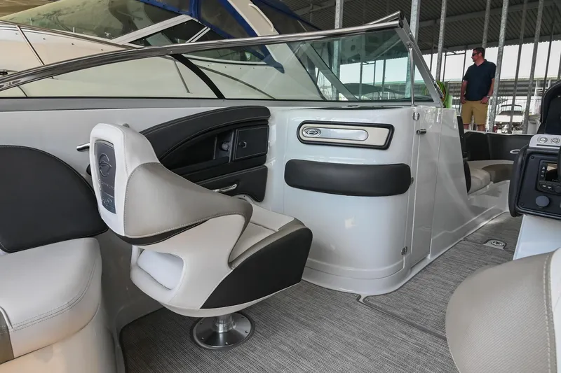 Slide: The Image of 2021 Crownline 265 SS boat interior with modern seating and sleek design. - 19