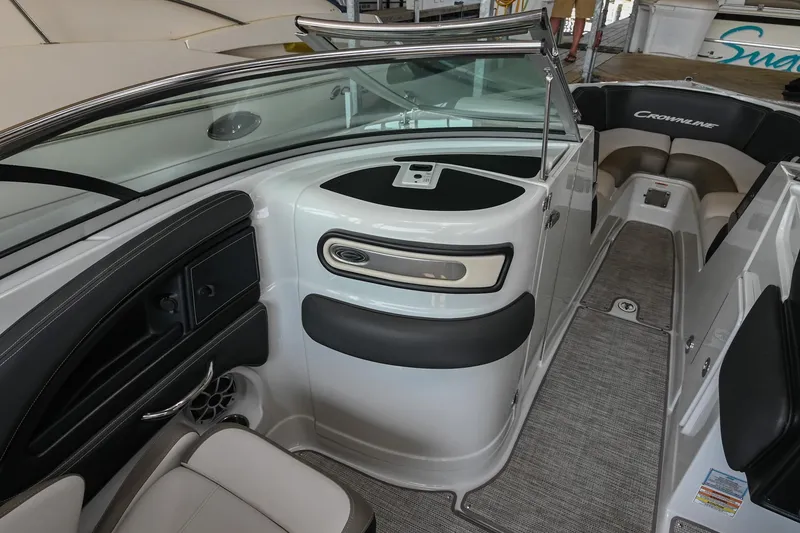 Slide: The Image of 2021 Crownline 265 SS boat interior with sleek seating and modern dashboard design. - 20