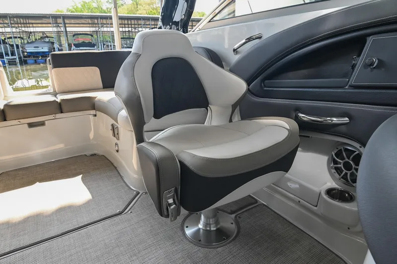 Slide: The Image of 2021 Crownline 265 SS boat interior with modern seating and sleek design. - 23