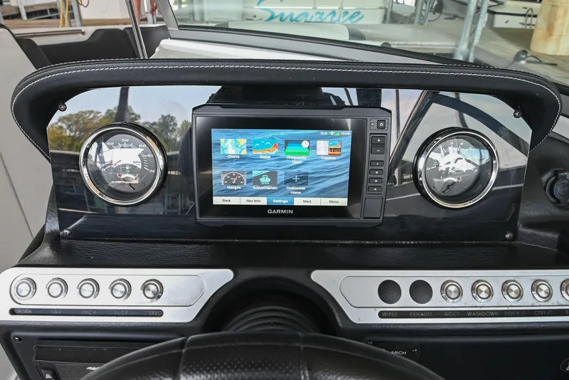 Slide: The Image of Dashboard of 2021 Crownline 265 SS boat with Garmin navigation system. - 28