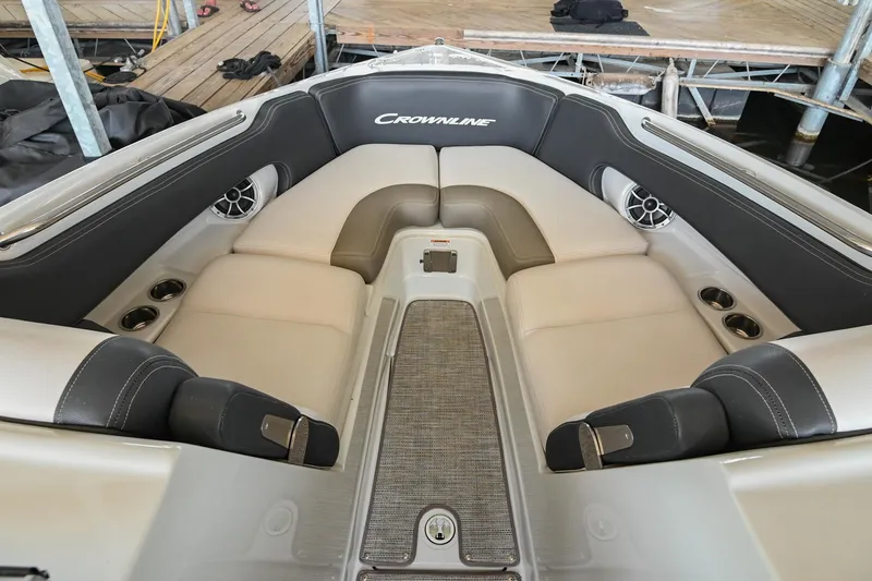 Slide: The Image of 2021 Crownline 265 SS boat interior with cushioned seating and speakers. - 32