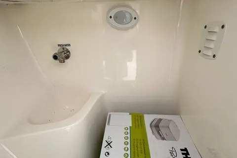 Slide: The Image of 2024 Key West 203 DFS interior with fresh water tap and storage box. - 13