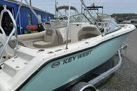 Slide: The Image of 2024 Key West 203 DFS boat on trailer, featuring sleek design and comfortable seating. - 2