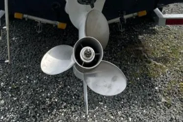 Slide: The Image of Propeller of 2024 Key West 203 DFS boat on gravel surface. - 5