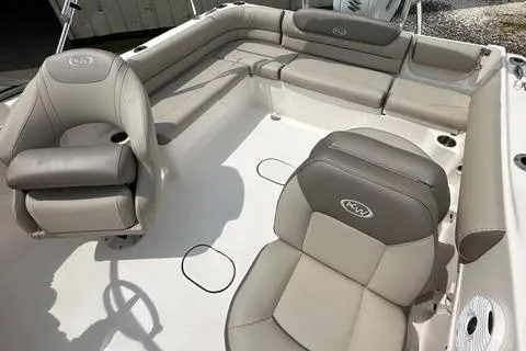 Slide: The Image of 2024 Key West 203 DFS boat interior with beige and gray seating. - 8